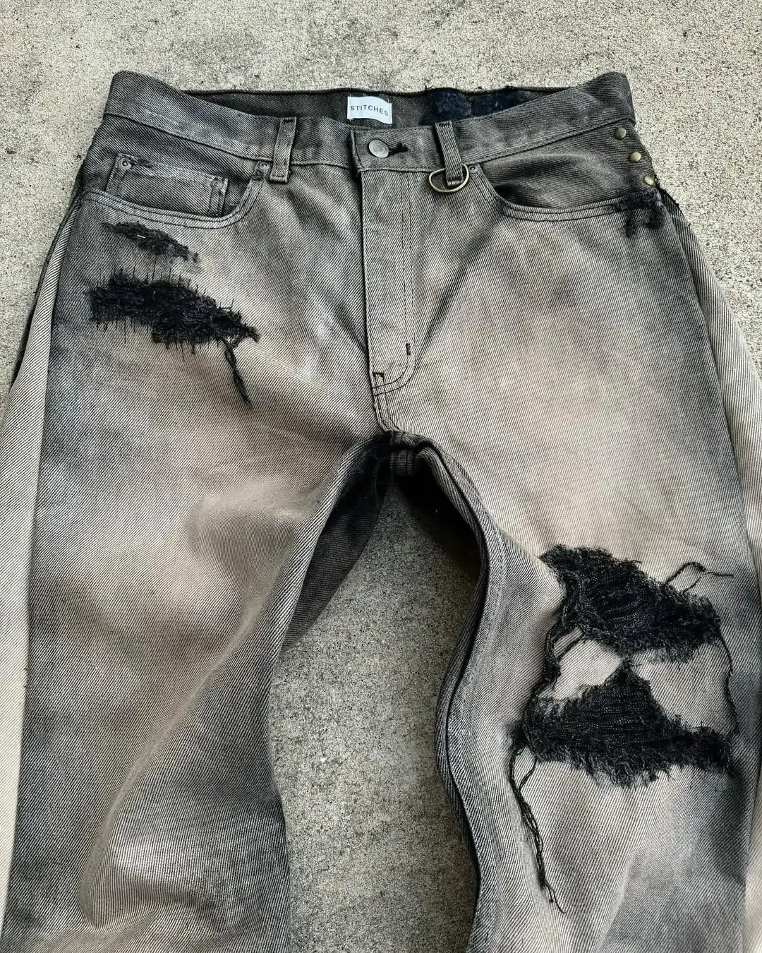 FRAYED PATCH JEANS
