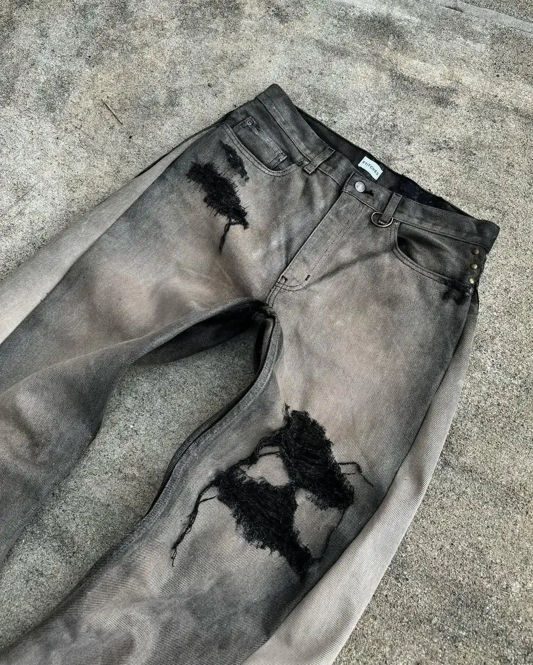 FRAYED PATCH JEANS